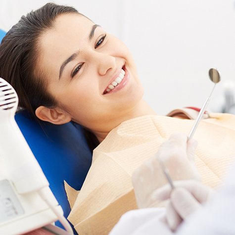 Woman listening to dentist