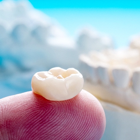 Close-Up of Dental Crown on a Person’s Finger