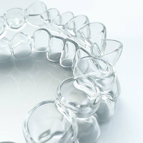 A set of clear, plastic aligners that are custom-made to fit a patient who is preparing to receive Invisalign