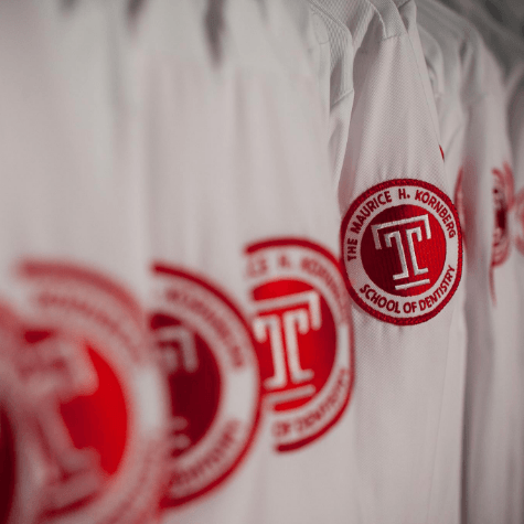 Temple University Dental School logo on lab coats