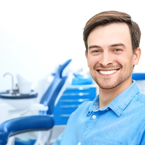 A young man sitting in a dental chair