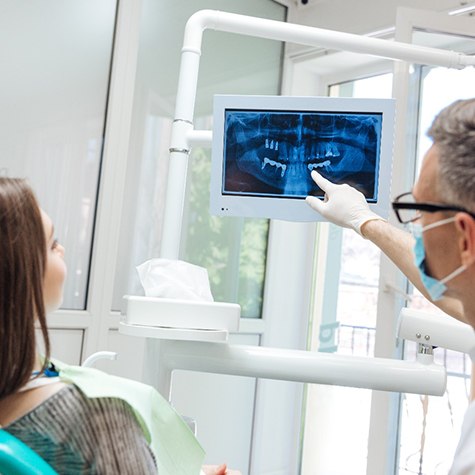 dentist showing X-rays to a patient 