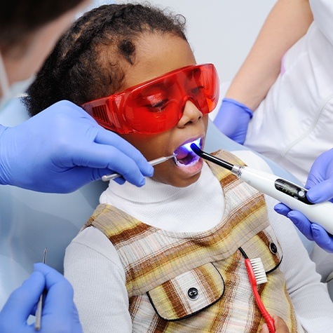 child receiving dental sealants