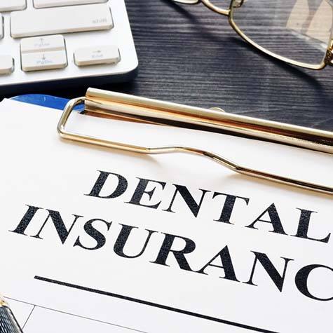 Dental insurance paperwork for the cost of dental emergencies in Doylestown