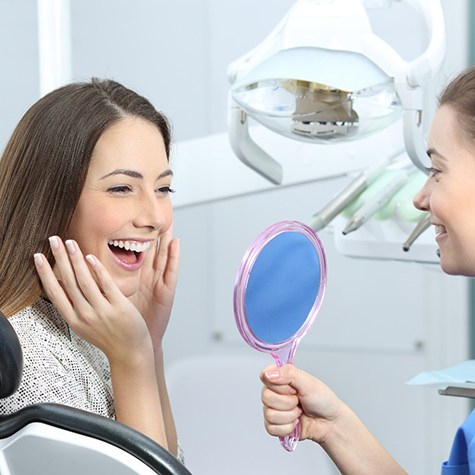  Woman smiling with dentist