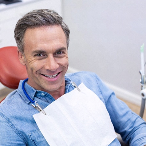 Smiling dental patient, prepared for root canal therapy