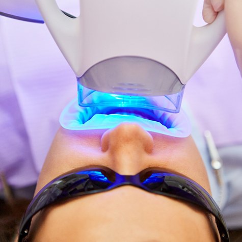 A person undergoing Zoom! Whitening during a dental visit